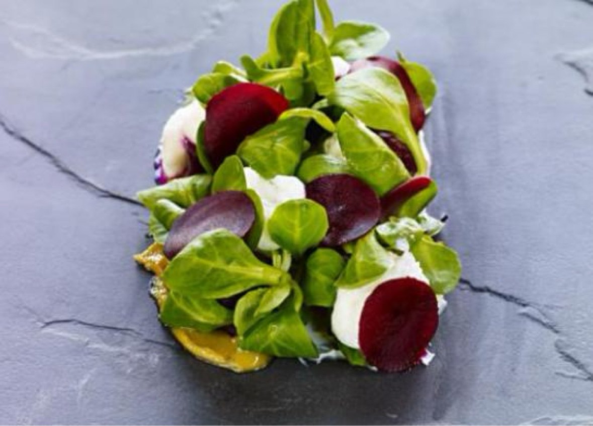 Beet and burrata garden salad on slate