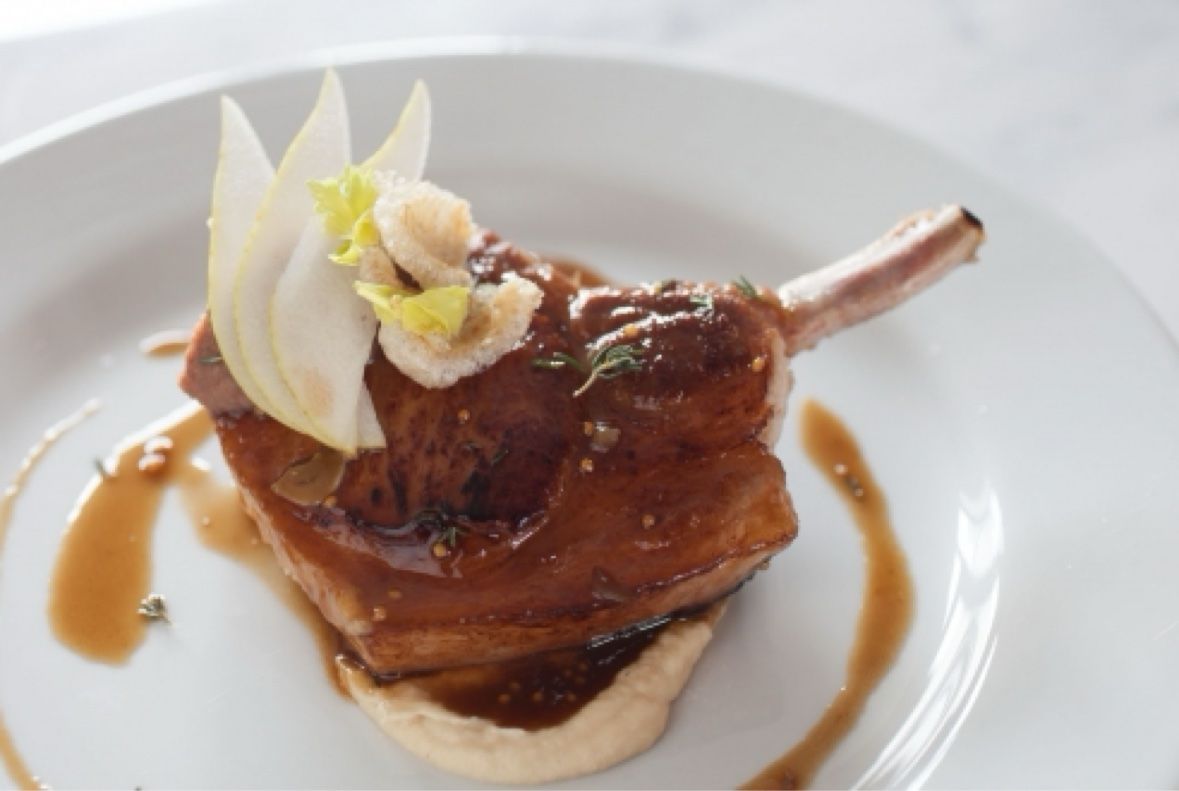 Bone in pork chop with pear and jus