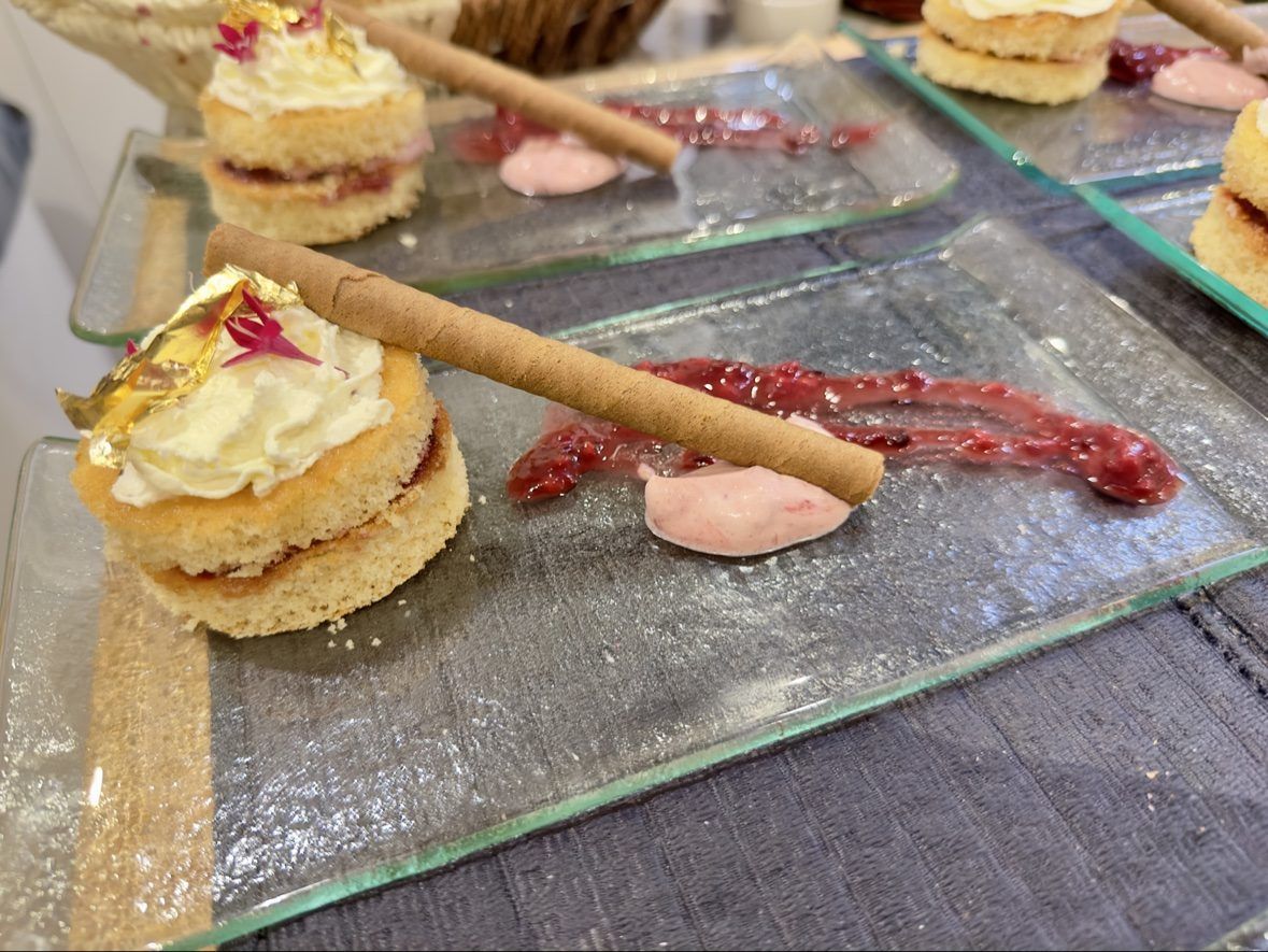 Mini victoria sponge with gold leaf and raspberry