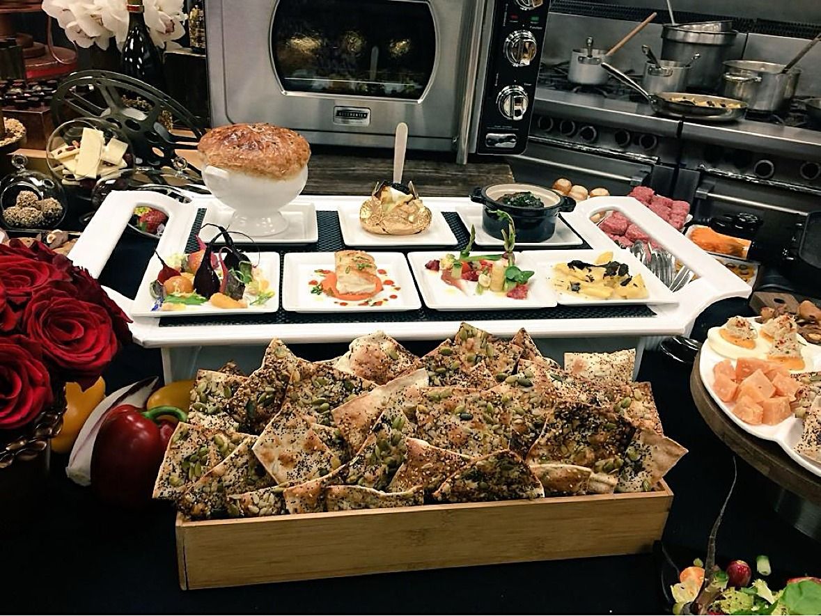 Catering spread with flatbreads and plated dishes