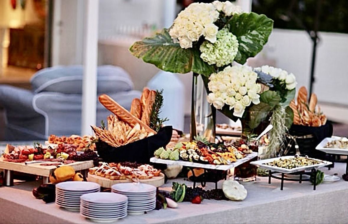 Grazing table with breads charcuterie and florals