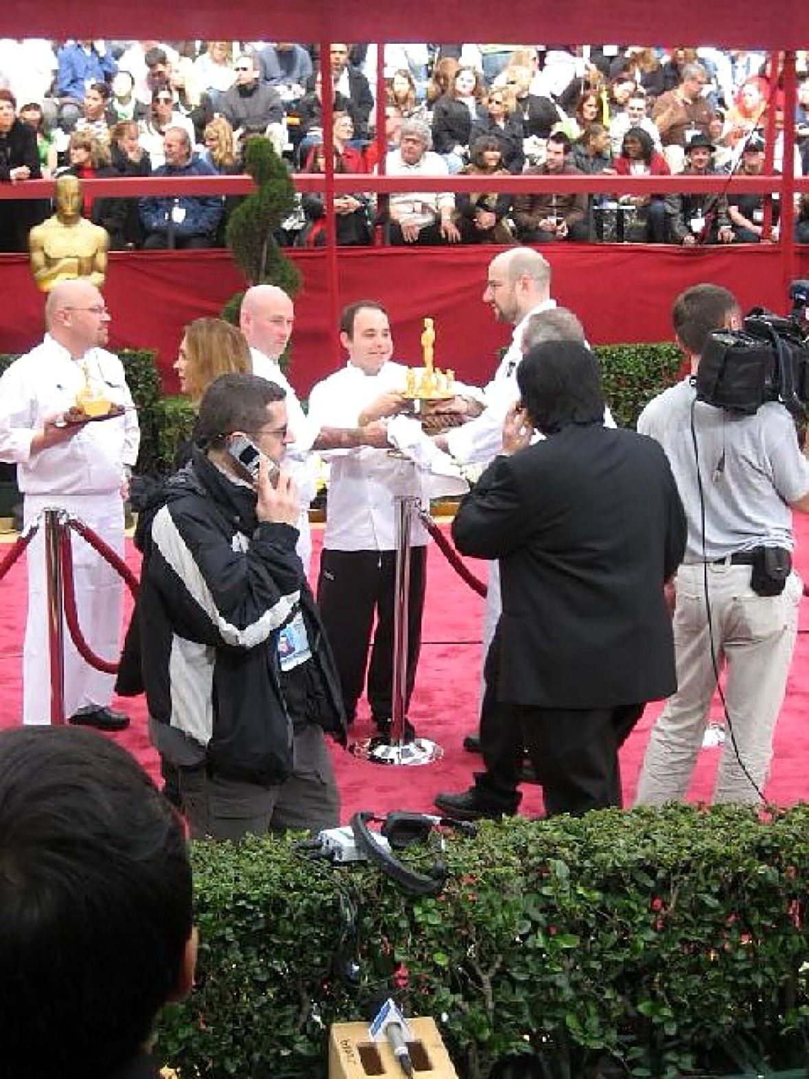 Chefs with Oscar desserts on the red carpet