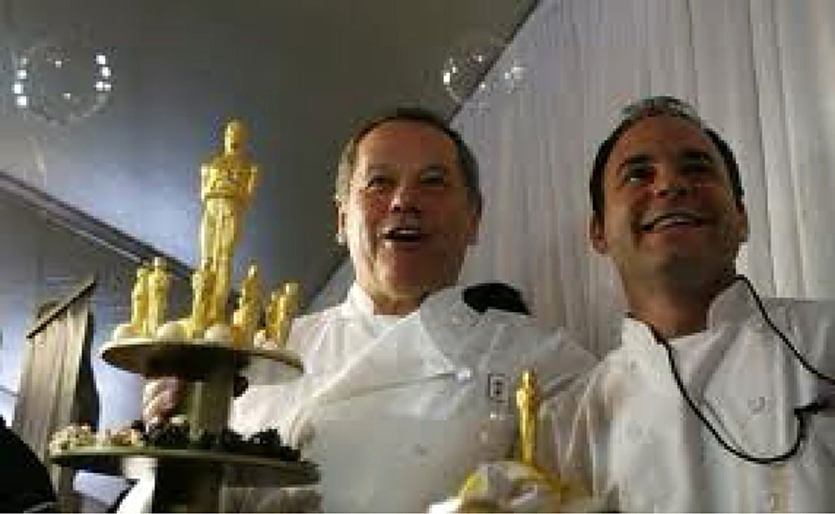 Two chefs with the Oscar dessert tower at the Governors Ball