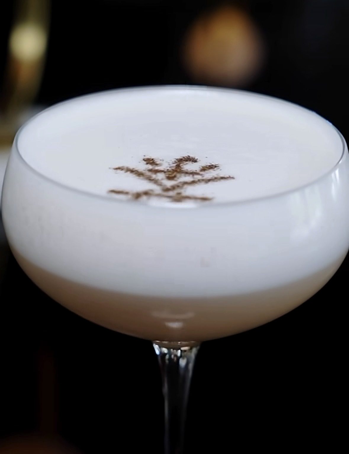 White foam cocktail finished with a cocoa design