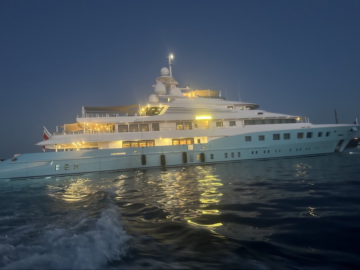Yacht lit up at anchor after dark
